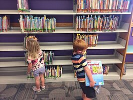 Violet and Quinn Tunison were excited to back at the Howard Miller Public Library in Zeeland.
