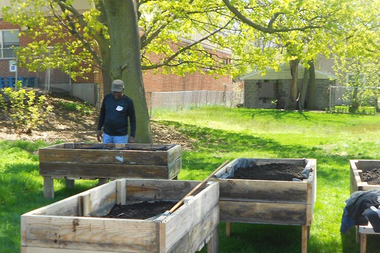 Resident David Moore checking out his gardening box.