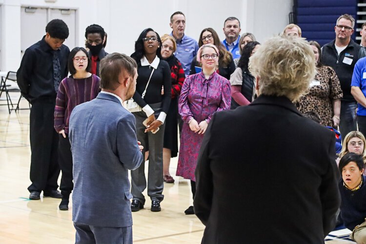 Peggy Helsel, DAKC's development director, passes the mic to students, which instills confidence in all who participate.