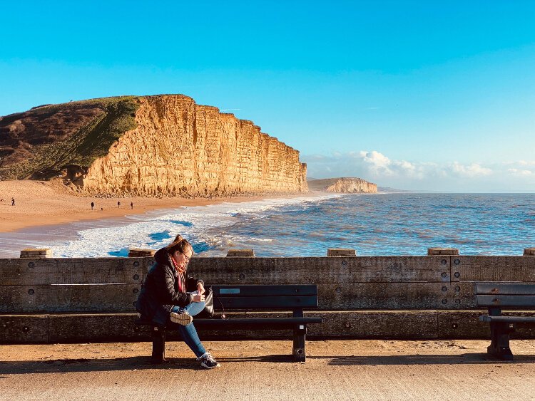 Dawn Pick Benson pauses in West Bay Cliffs in Dorset, United Kingdom.