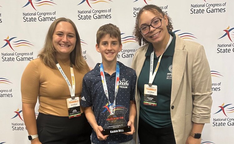 Kaidin Bell, 2024 National Congress of State Games Youth Athlete of the Year (center) poses with Julie Shields, director, Meijer State Games of Michigan (left) and Courtney Miner, Event Coordinator, Meijer State Games of Michigan.