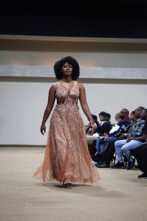 Up-and-coming designer and KCAD alum Demi McNeal debuts her custom evening wear brand, Dominique Alyse, with a successful fashion show in Michigan.