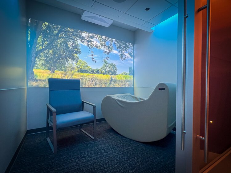 Comfy furniture and the serene, soothing, immersive video landscape from Grand Rapids' Blandford Nature Center help neurodivergent travelers reconfigure before their flight.