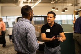 People talk during a KDL Work Hub open house.