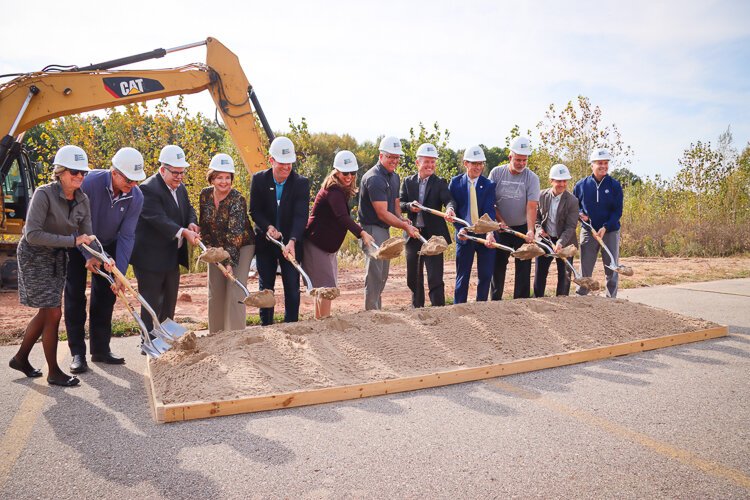 Members of the Winning Streak team dig in at the shovel-ready Meijer Sports Complex project.