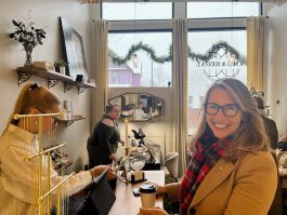 U.S. Rep. Hillary Scholten, D-Grand Rapids, smiles as she checks out at a local shop.