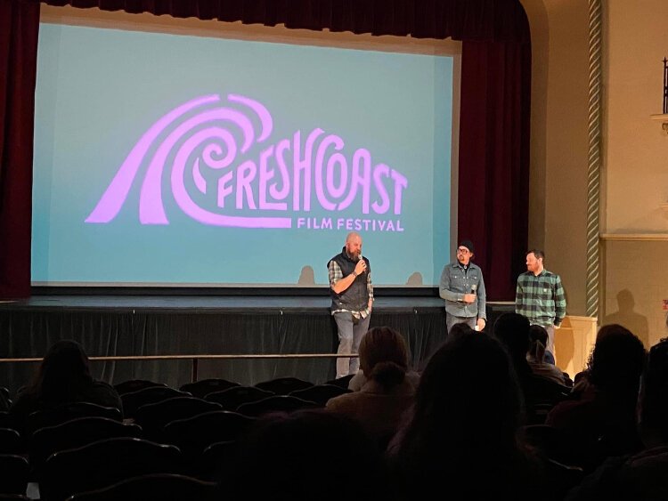 Stacy Bare (left) speaks at the Fresh Coast Film Festival. His past as an adventure filmmaker converges with his leadership at Friends of Grand Rapids Parks through the Fresh Coast Film Festival.