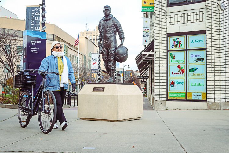 Ken Miguel-Cipriano models the "walk your wheels on the sidewalk" ordinance.