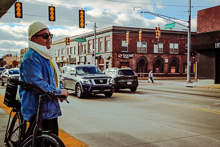 Burton Heights business district is where Garfield Park's Ken Miguel-Cipriano grabs his bus to work.