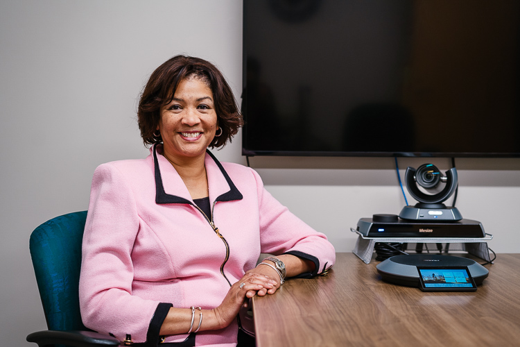 Audrey Smith with a webcam used to connect child psychiatrists to students. 