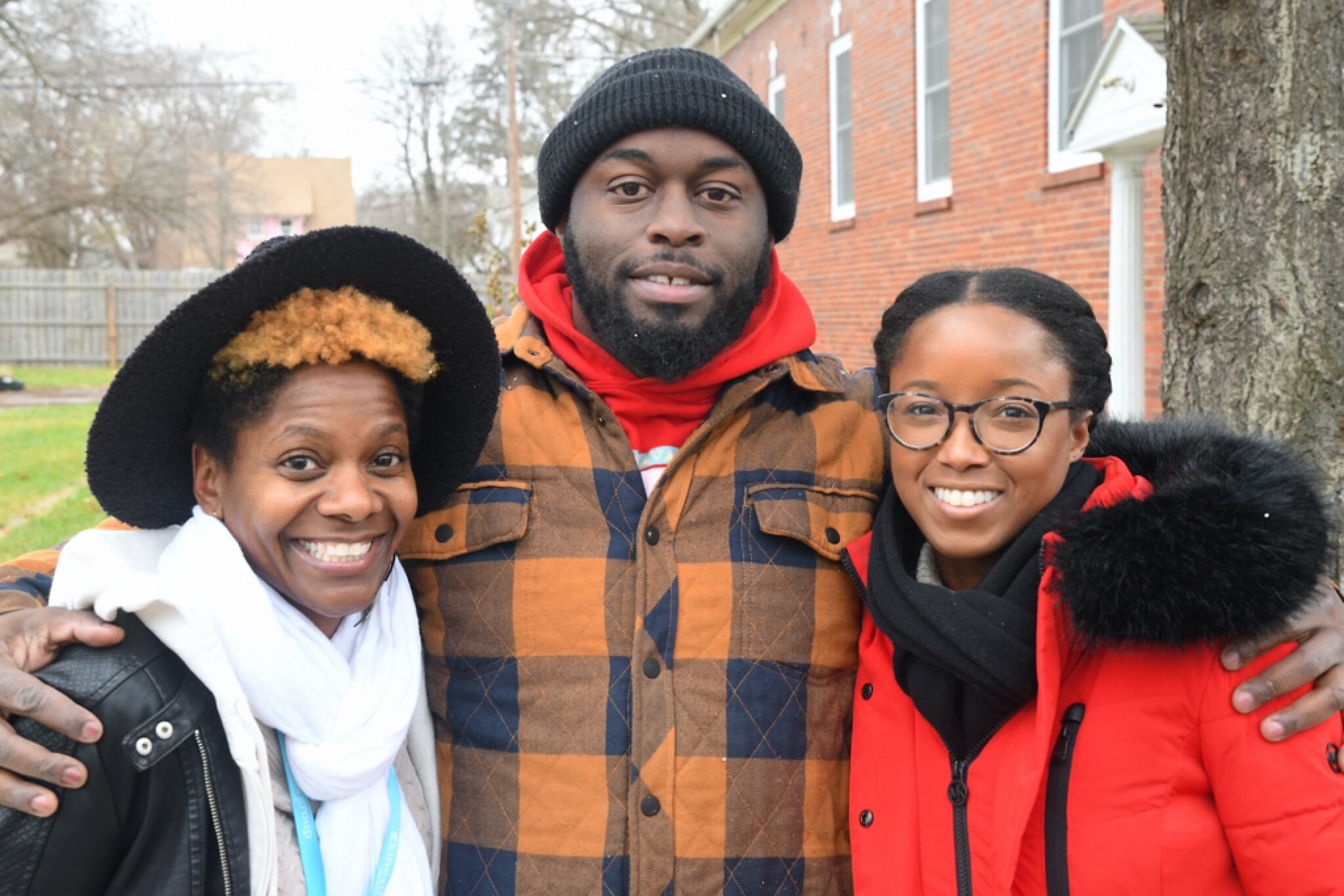 (L – R) Deidre Fields, community partner, James Gunter, community advocate, and Ashley Hines, executive director of Benton Harbor Community Development Corporation, in front of the African American History Gallery on Broadway Avenue in Benton Harbor.