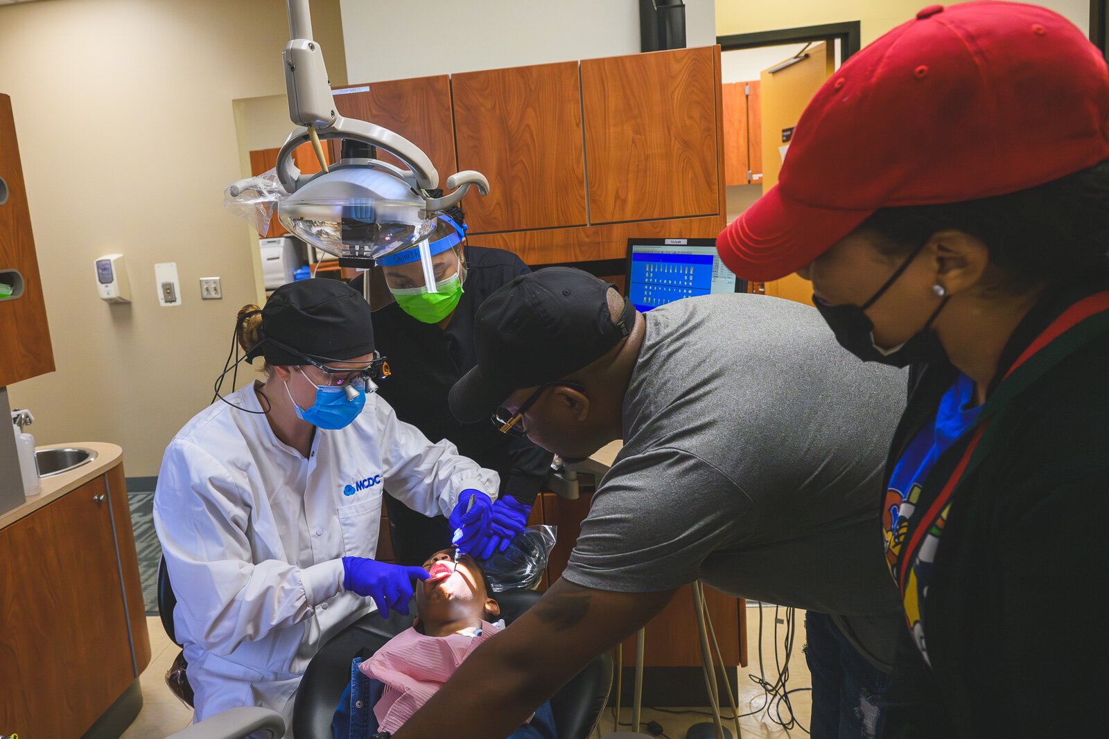 Dentist, Dr. Gina Tischendorf, takes a final peak at Giovanni's teeth.