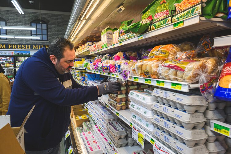 Renan Bashi stocks eggs at Parkway Foods.
