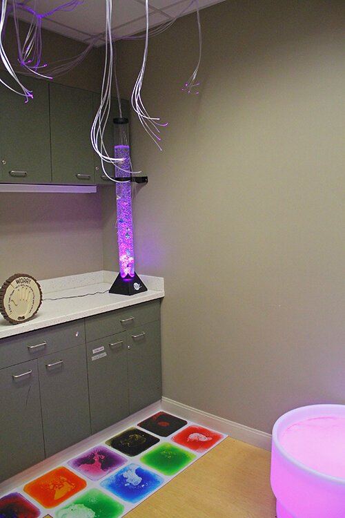 A corner of the sensory room, is described as a sanctuary of serenity and sensory stimulation.