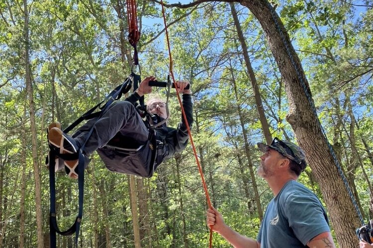 Jeff VanDyke tries out the adaptive rock climbing wall at Muskegon Luge and Adventure Sports Park.